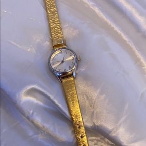Small hand watch, gold faux leather band.